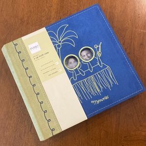Photo album holds 200 4x6” photos, 50 pages. Blue & lime green, palm tree design